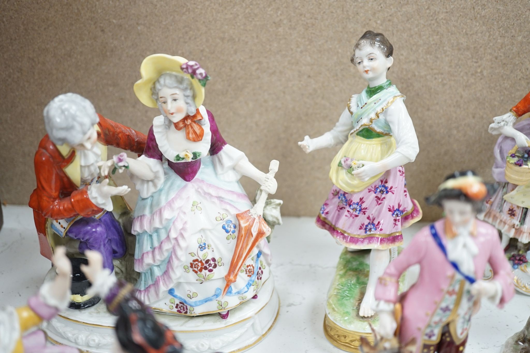 A large collection of small to medium German, French and English porcelain figurines and groups, tallest 18cm